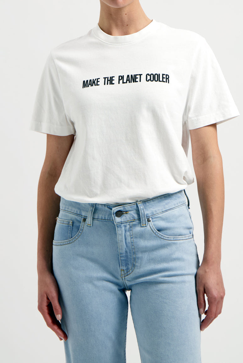 Sustainable Mud Jeans crafted from eco-friendly denim in light blue, paired with a white ethical slogan tee.