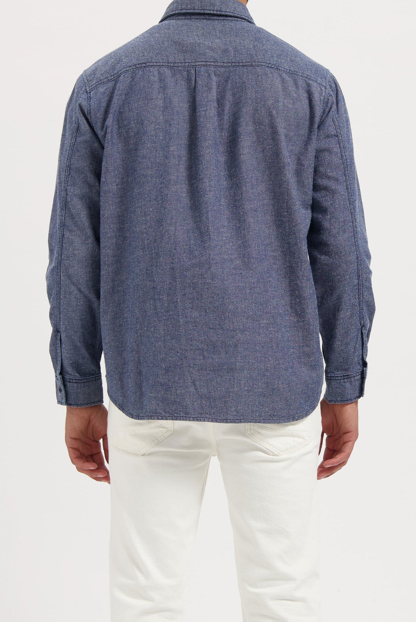 Sustainable Mud Jeans in deep indigo denim, crafted with organic cotton, paired with a black T-shirt.