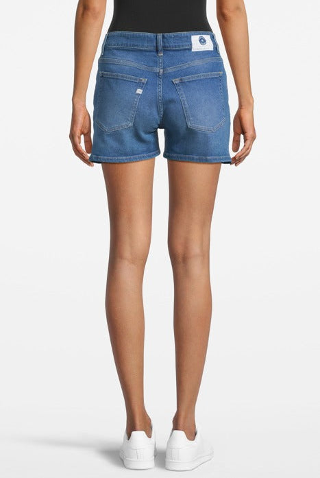 Casual blue denim shorts, worn with a black tank top, showcasing a back view with a focus on pockets and stitching details.