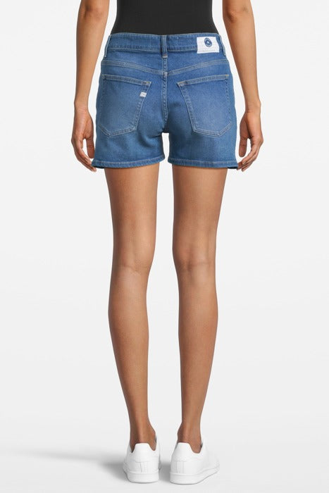 Casual blue denim shorts, worn with a black tank top, showcasing a back view with a focus on pockets and stitching details.