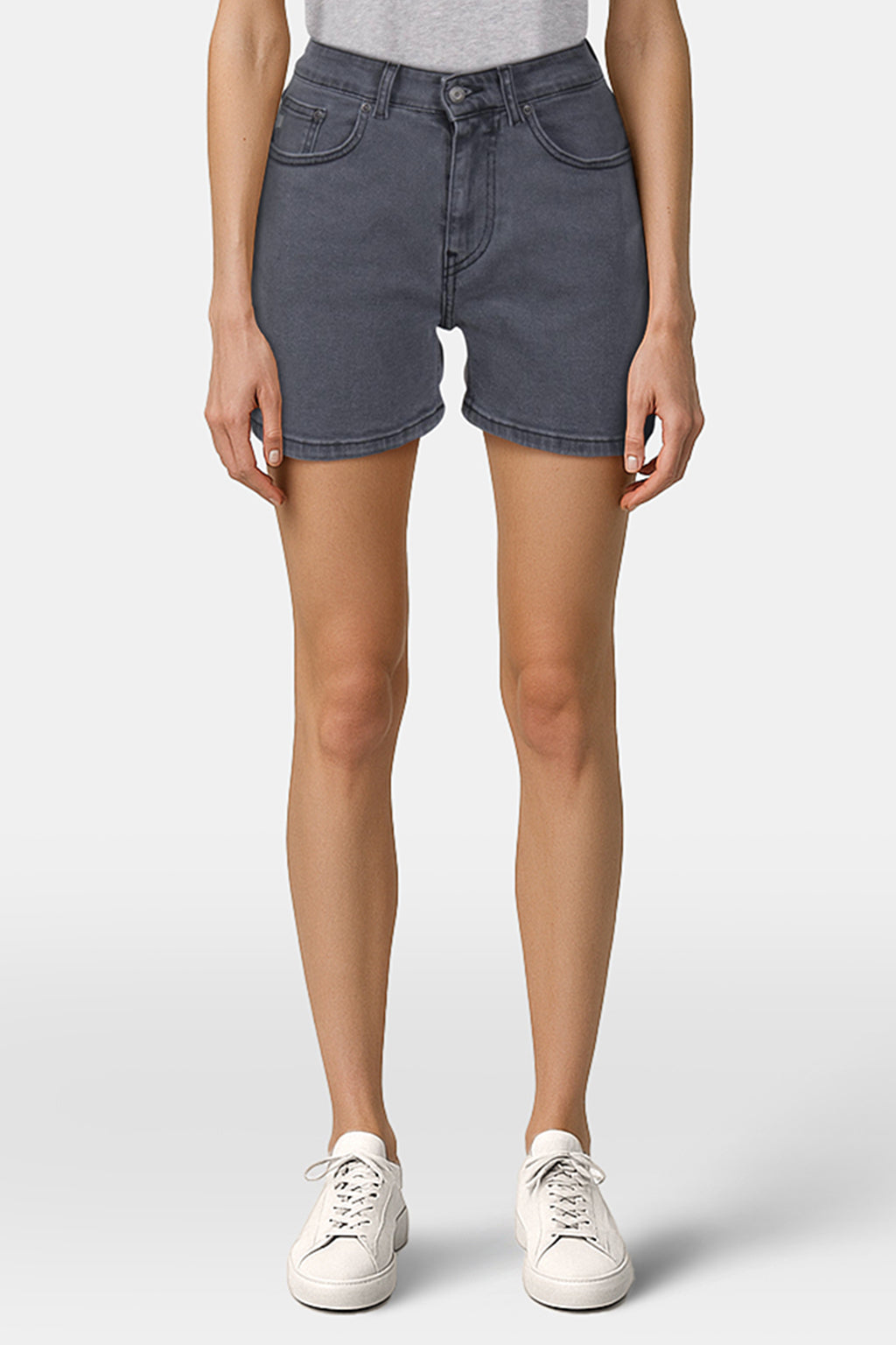 High-waisted gray denim shorts, featuring a tailored fit, paired with a casual gray top and white sneakers for a stylish look.