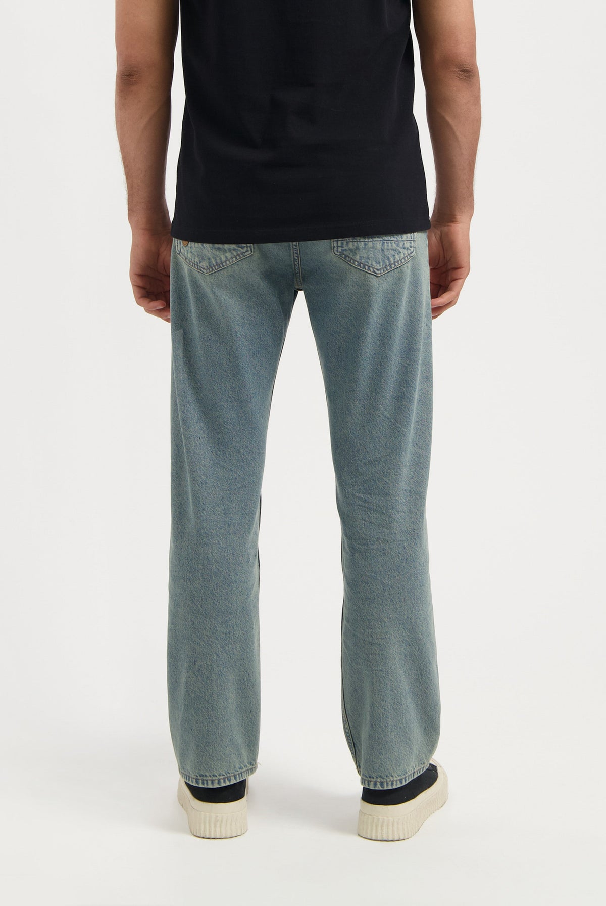 Sustainable MUD Jeans in sleek black denim, crafted for a modern fit, highlighting ethical fashion with premium materials.