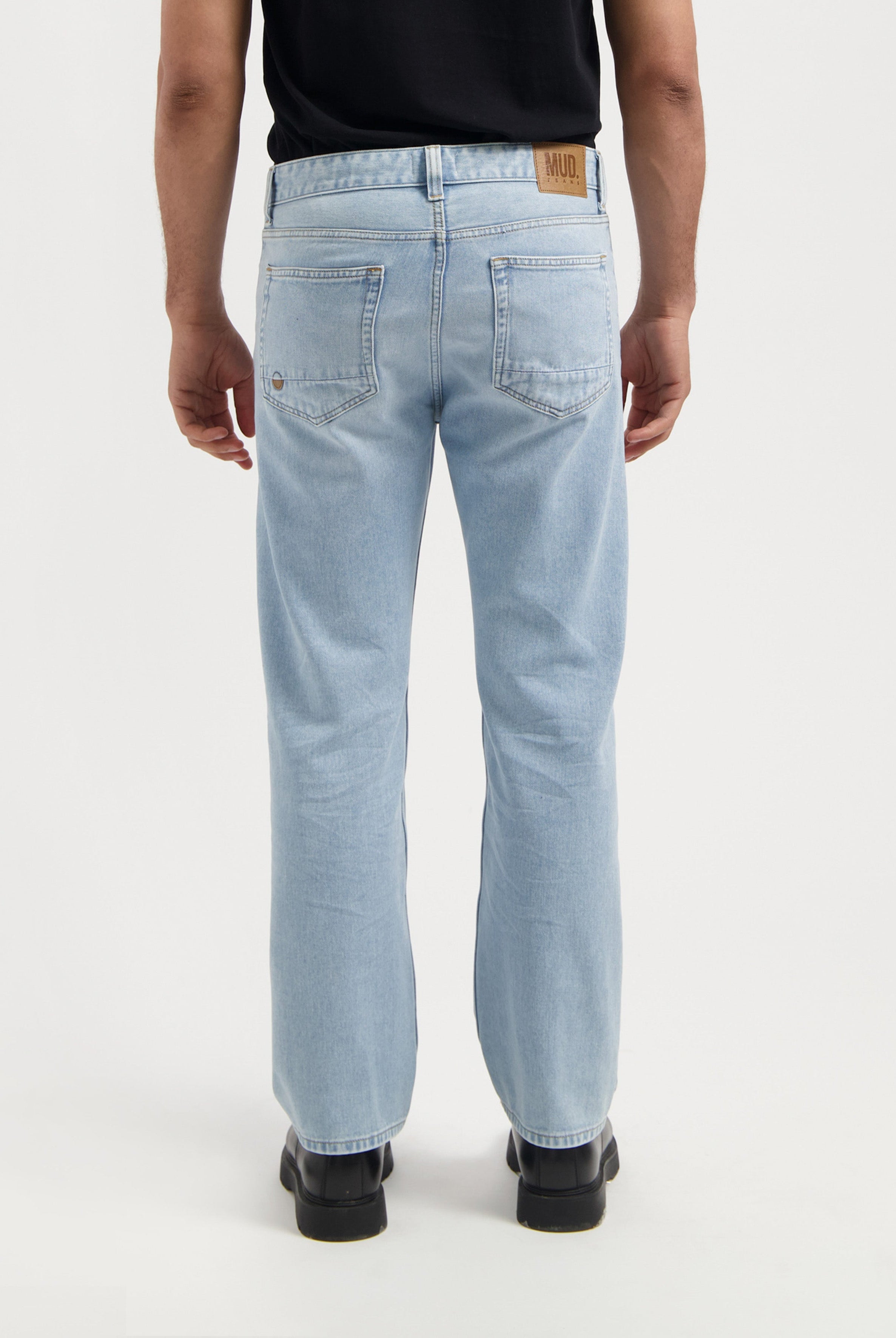 Sustainable MUD Jeans in deep blue, crafted from organic cotton, featuring a straight fit and ethical denim design.