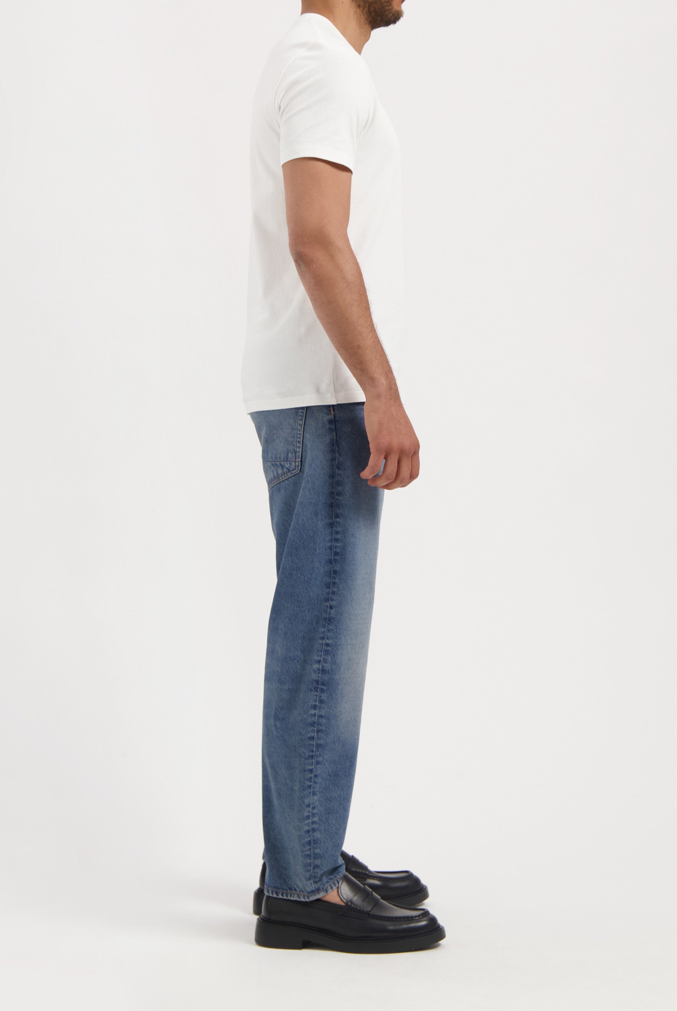Sustainable MUD Jeans in light blue denim, crafted from organic cotton, showcasing ethical fashion with classic stitching.