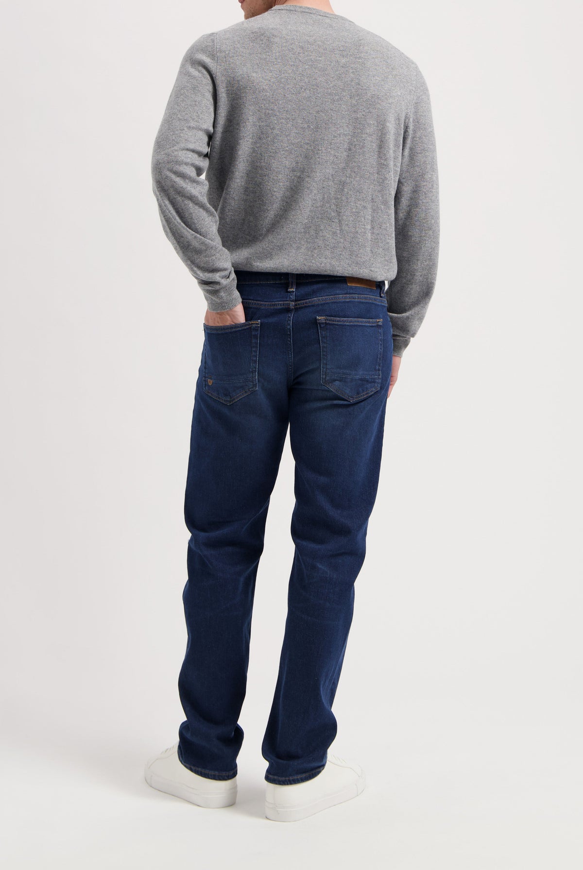 Sustainable MUD Jeans denim jacket in classic blue, crafted ethically with organic materials, paired with matching jeans.