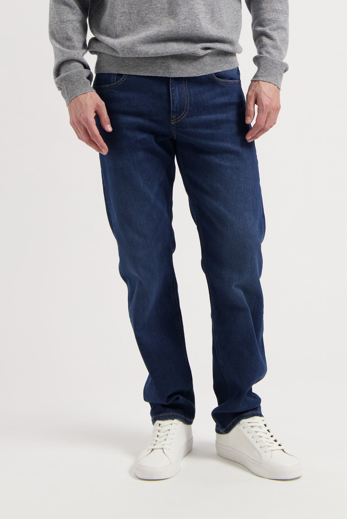 Sustainable MUD Jeans denim jacket in faded blue, featuring ethical organic cotton, worn with matching jeans.