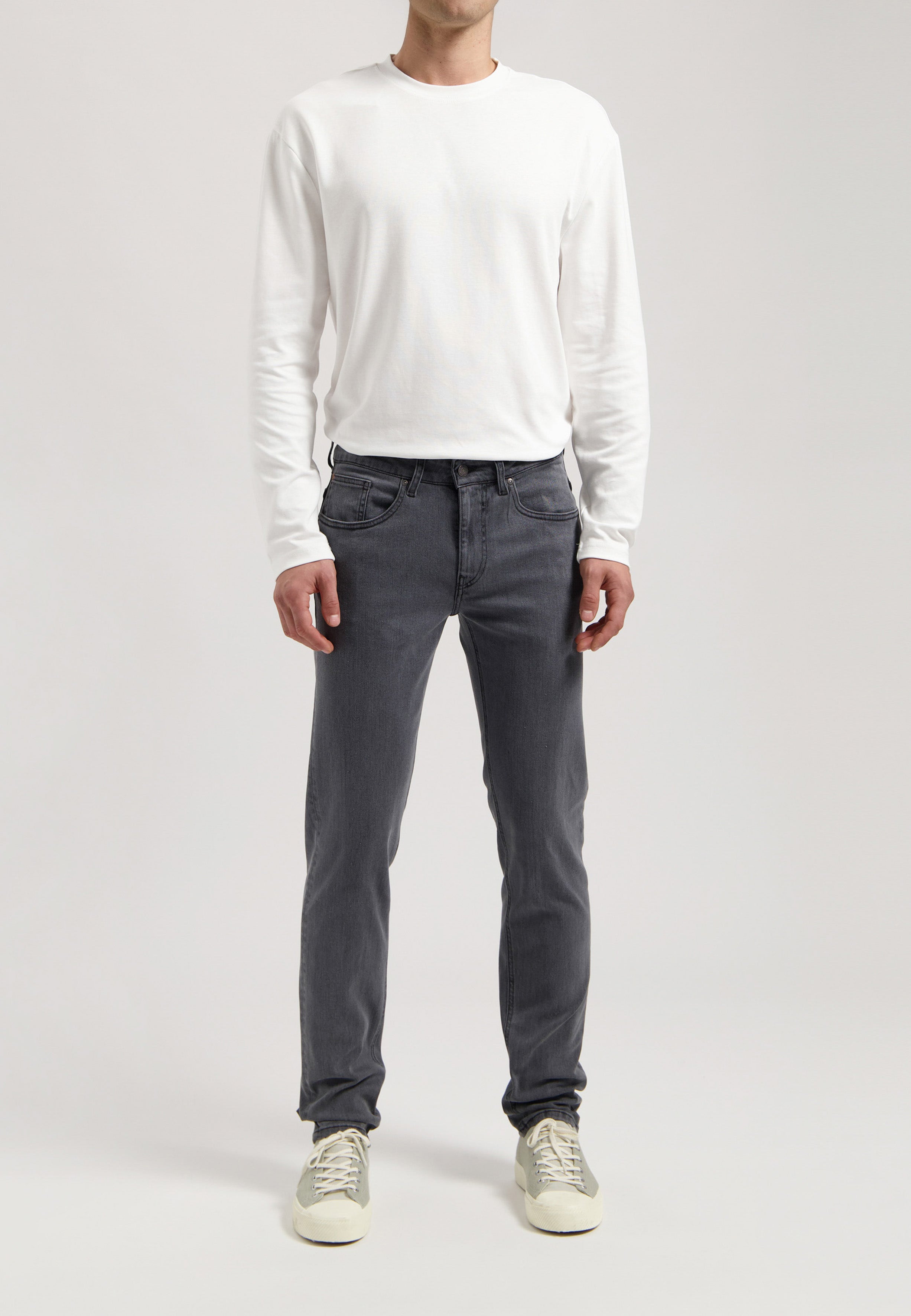 Sustainable MUD Jeans in dark denim, classic fit, showcasing ethical fashion with eco-friendly materials.