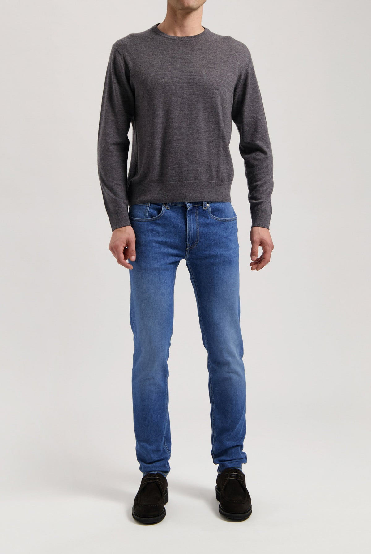 Sustainable MUD Jeans in classic blue denim, made from organic cotton, showcasing ethical fashion and eco-friendly craftsmanship.