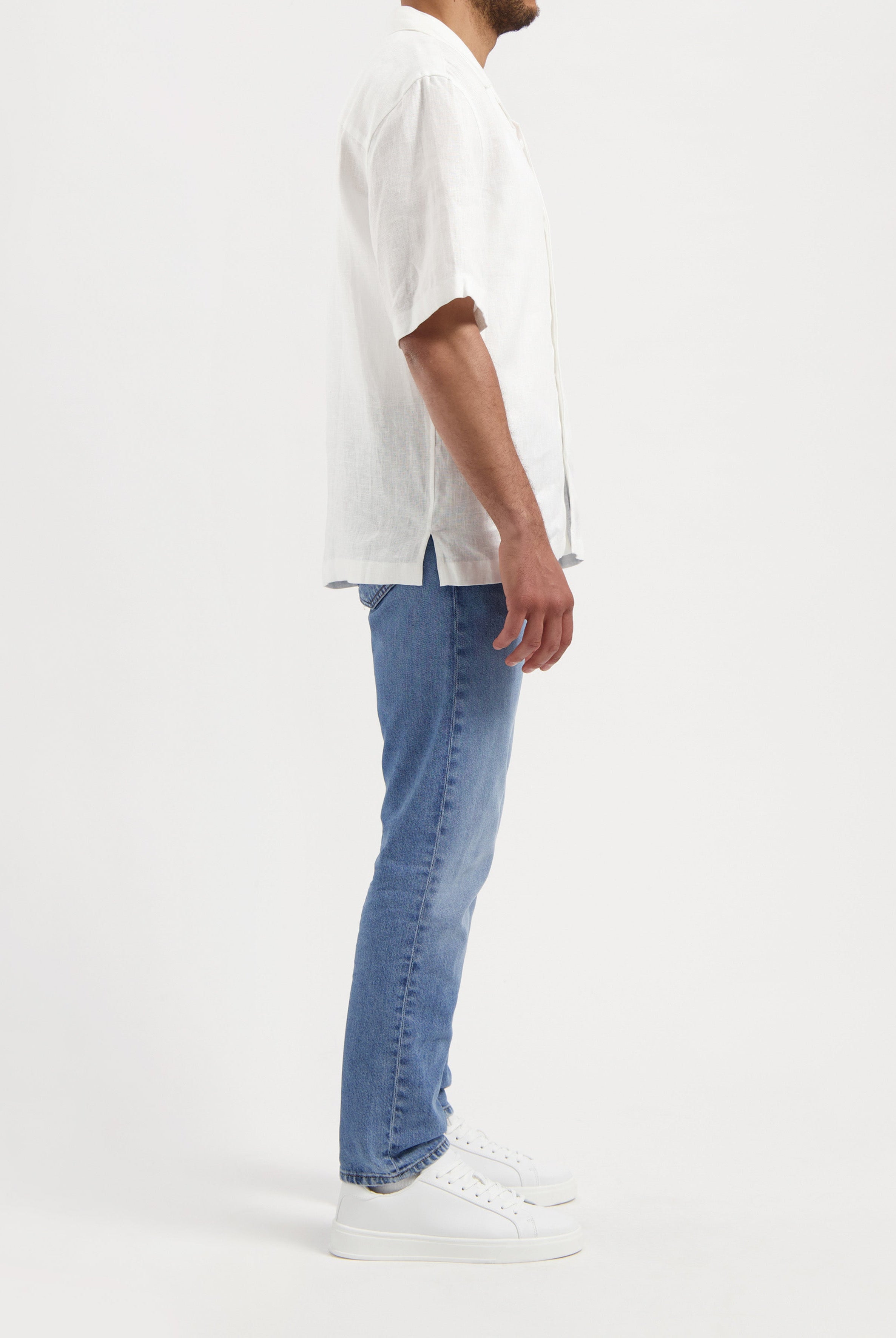 Sustainable MUD Jeans navy shorts in organic cotton, highlighting classic fit and ethical fashion focus.