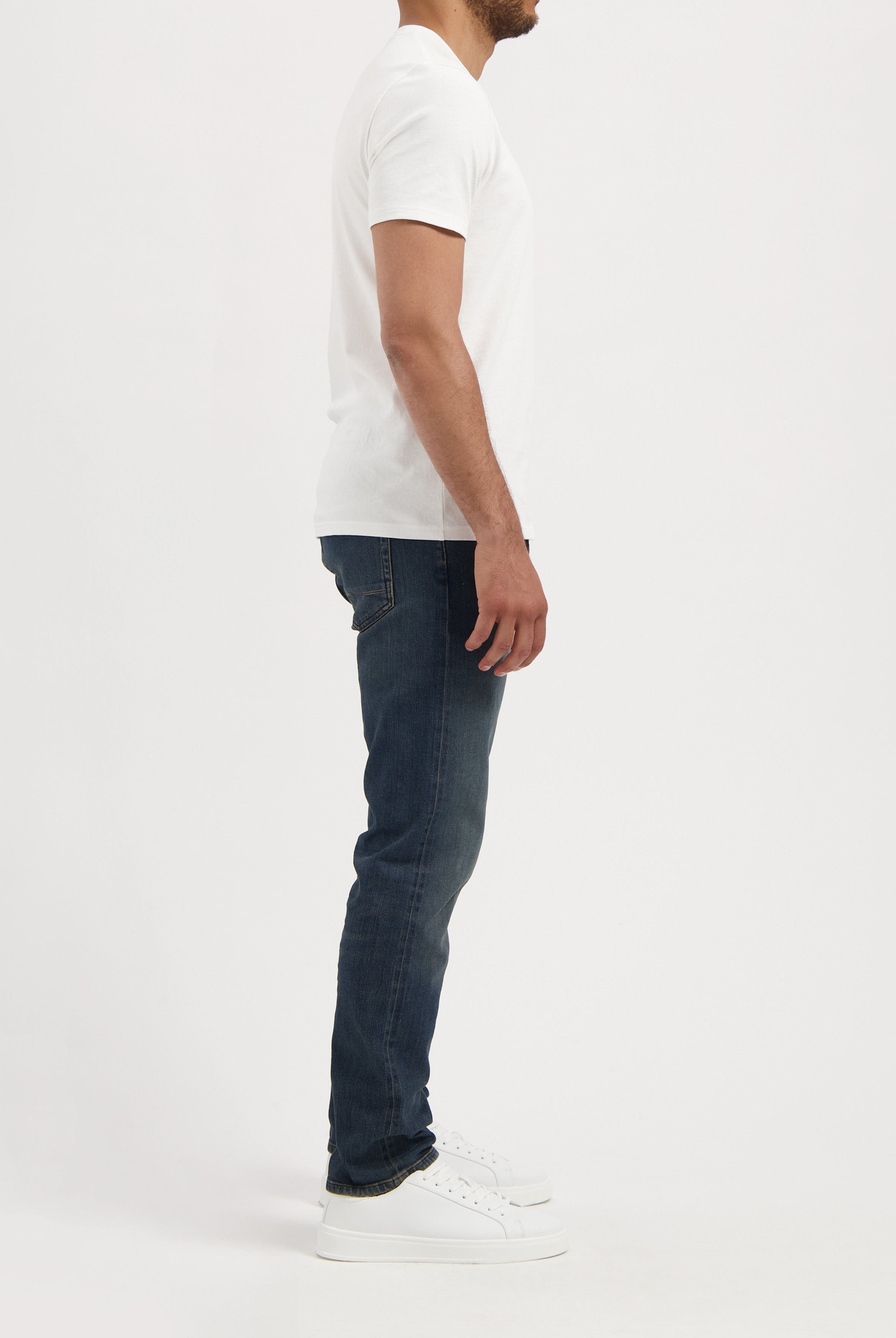Sustainable MUD Jeans in light blue denim, crafted from organic materials, showcasing classic rear pocket design.