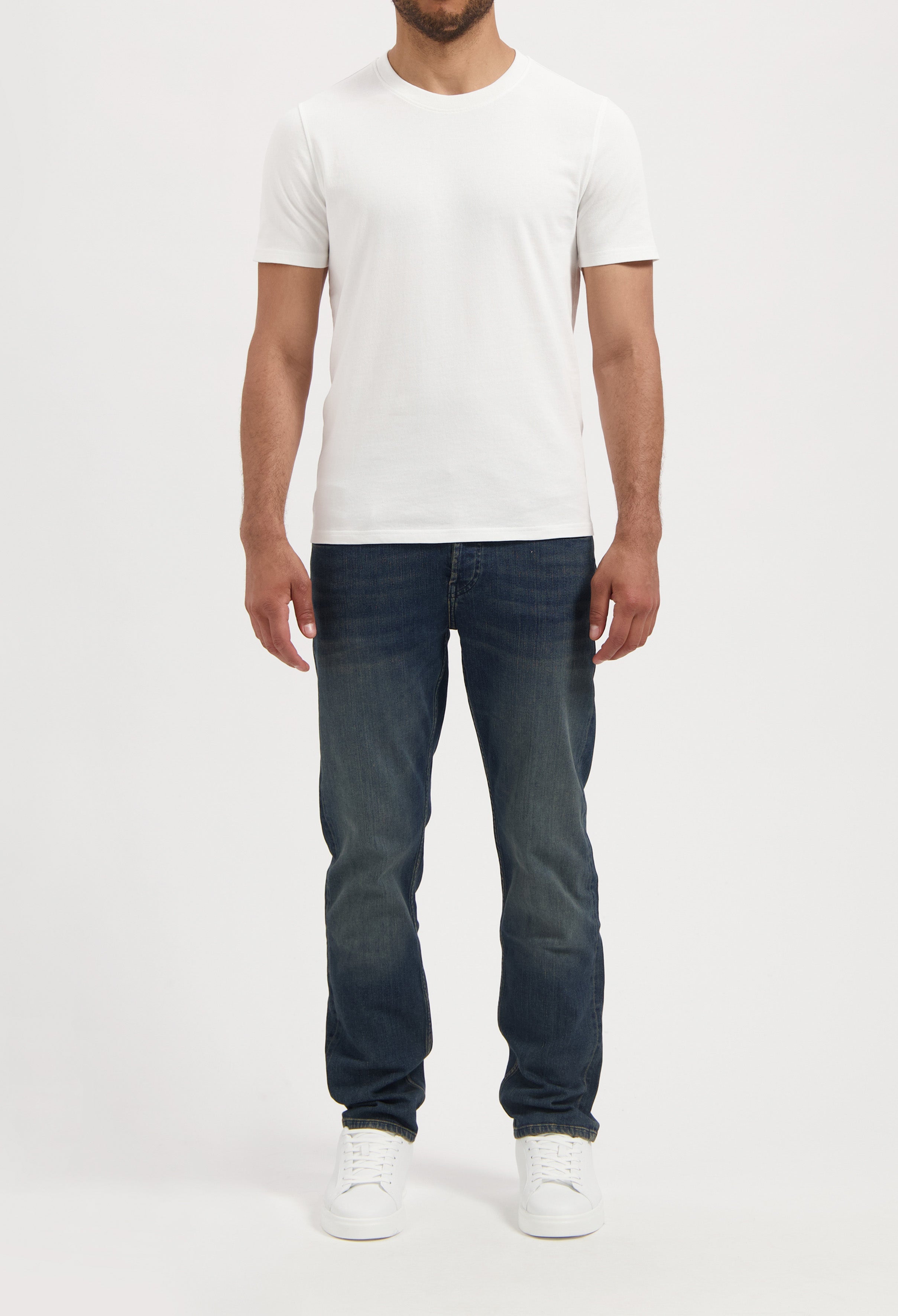 Sustainable MUD Jeans made from organic cotton, showcasing a classic fit in light blue denim for ethical fashion choices.