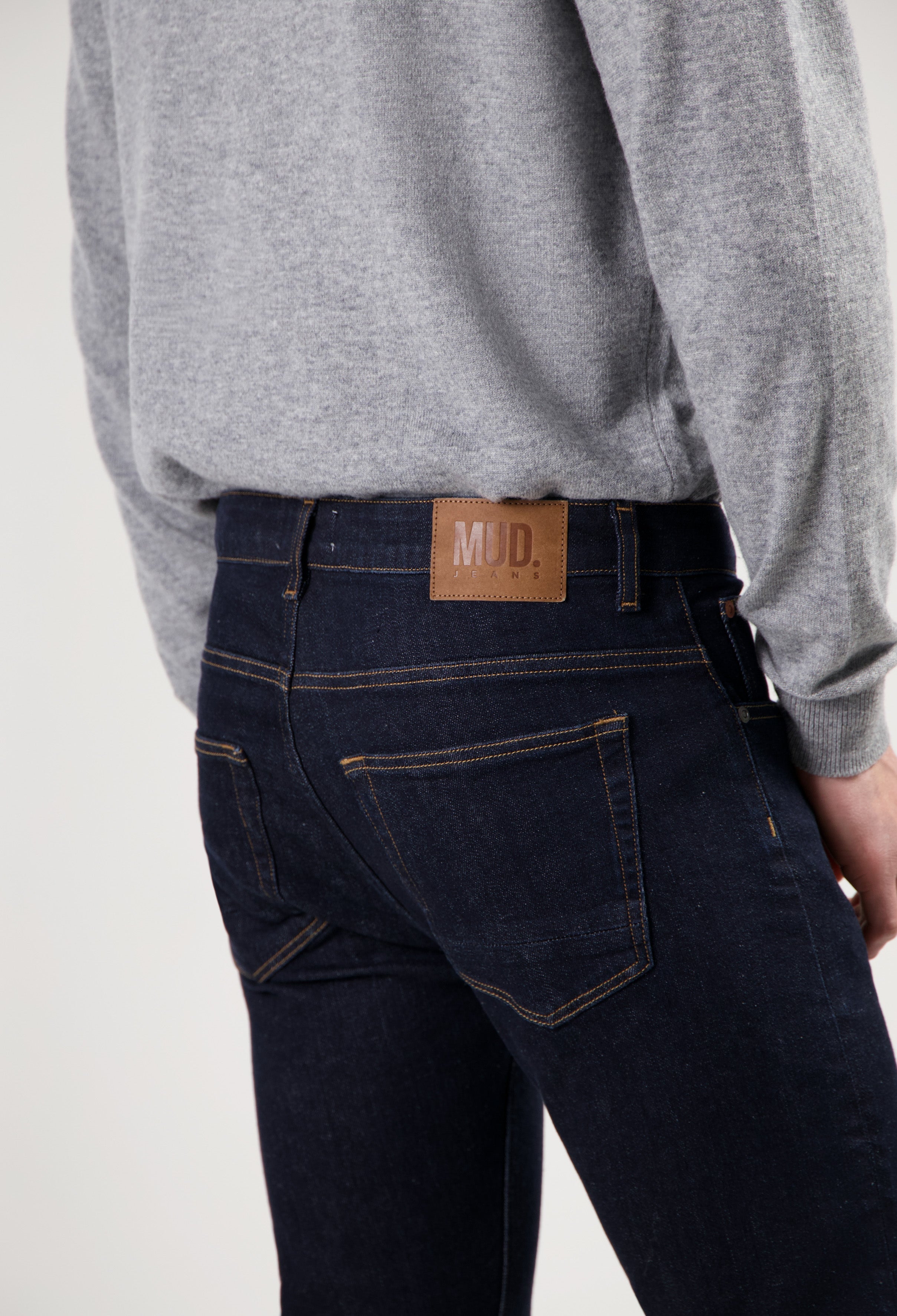 Sustainable MUD Jeans in dark denim, crafted from organic cotton, offering an ethical choice for modern casual wear.