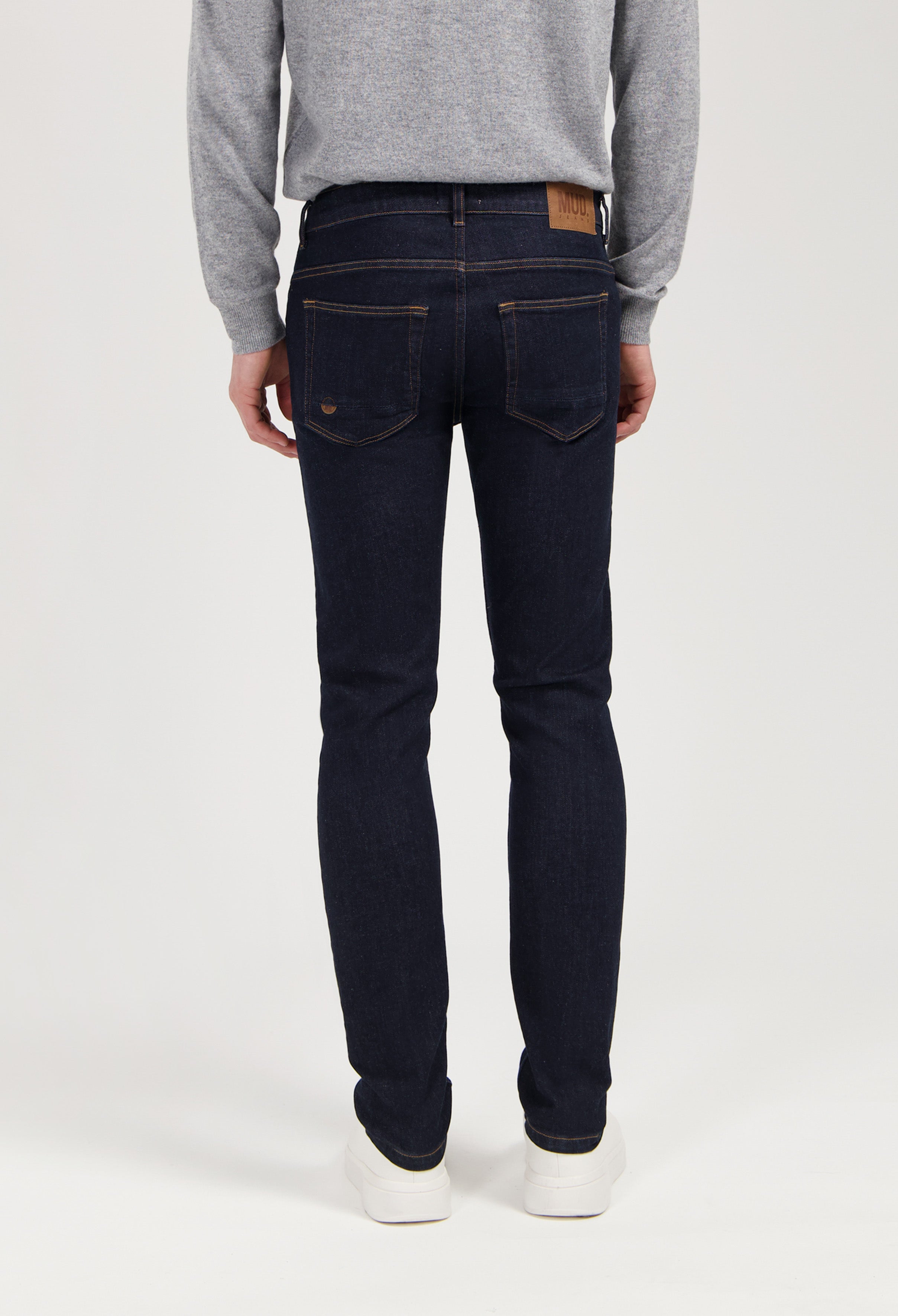 Sustainable MUD Jeans in a light blue wash, crafted from organic cotton, showcasing ethical denim in a straight fit.