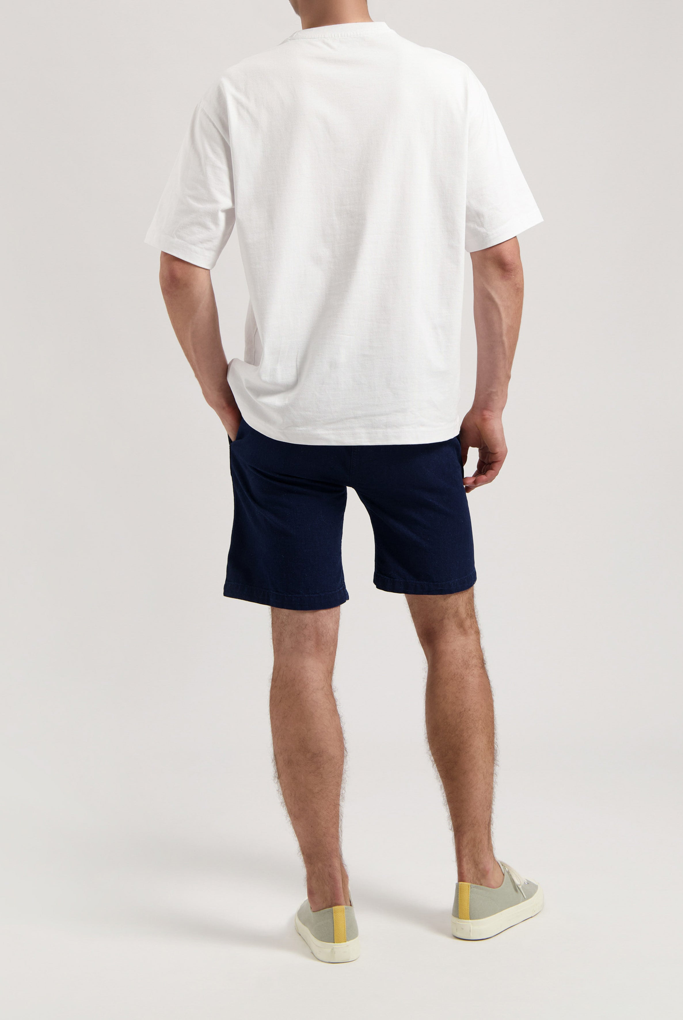 Sustainable MUD Jeans in light blue denim featuring back pocket details, crafted with ethical and eco-friendly materials.