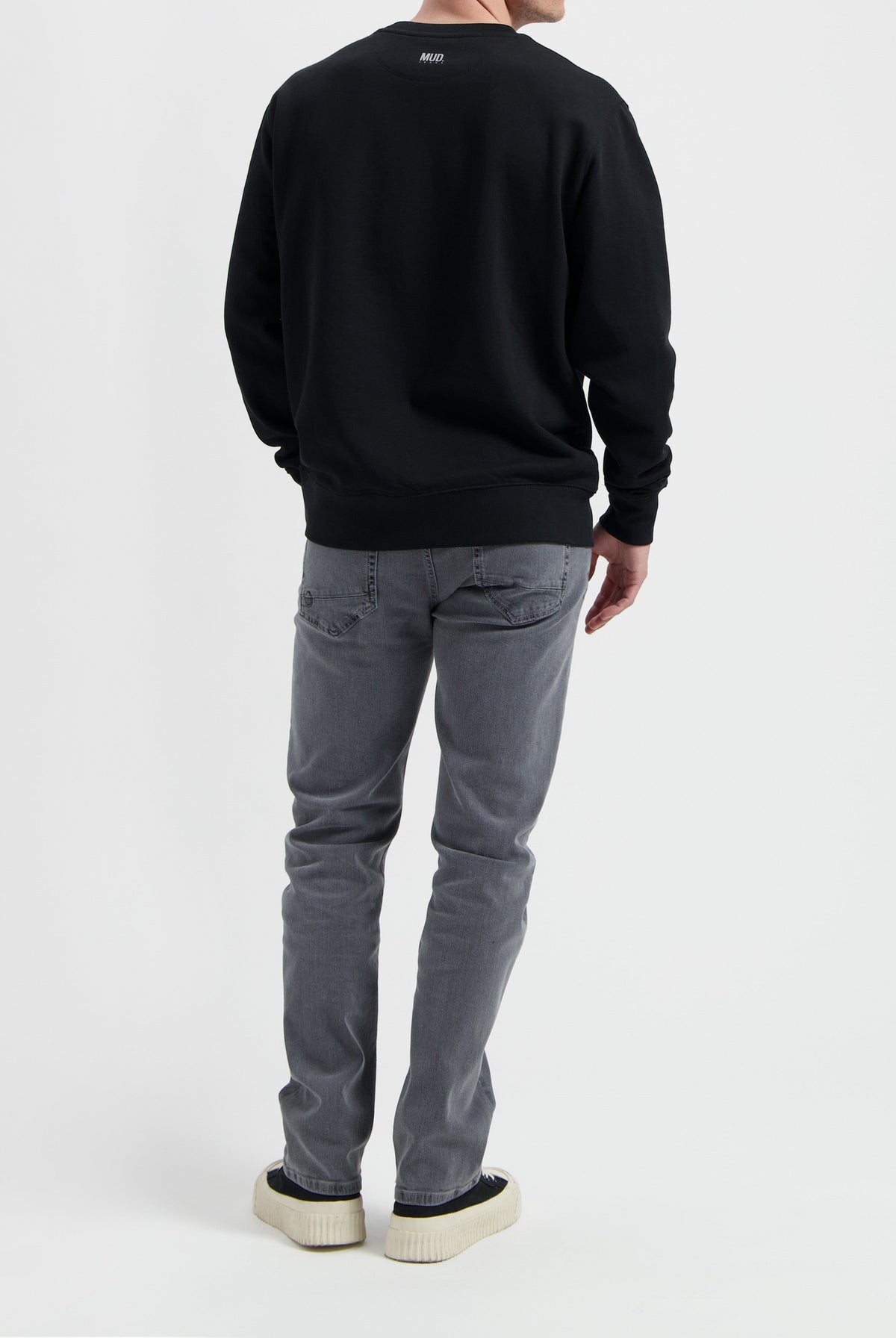 Sustainable MUD Jeans in light blue denim, crafted with organic cotton, showcasing ethical fashion with a classic fit.