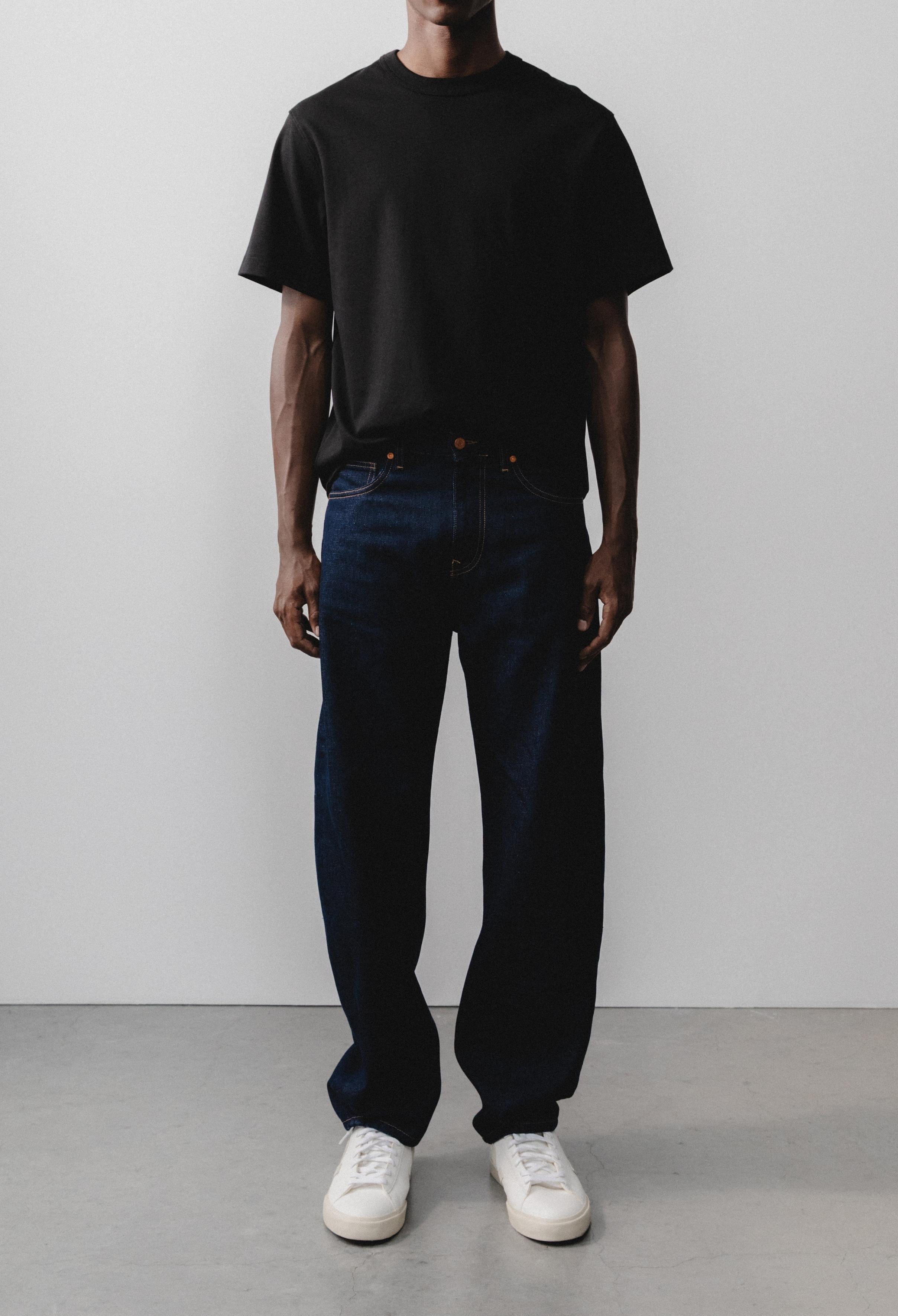 Sustainable MUD Jeans in light blue denim, crafted from organic cotton, showcasing ethical fashion and eco-friendly style.