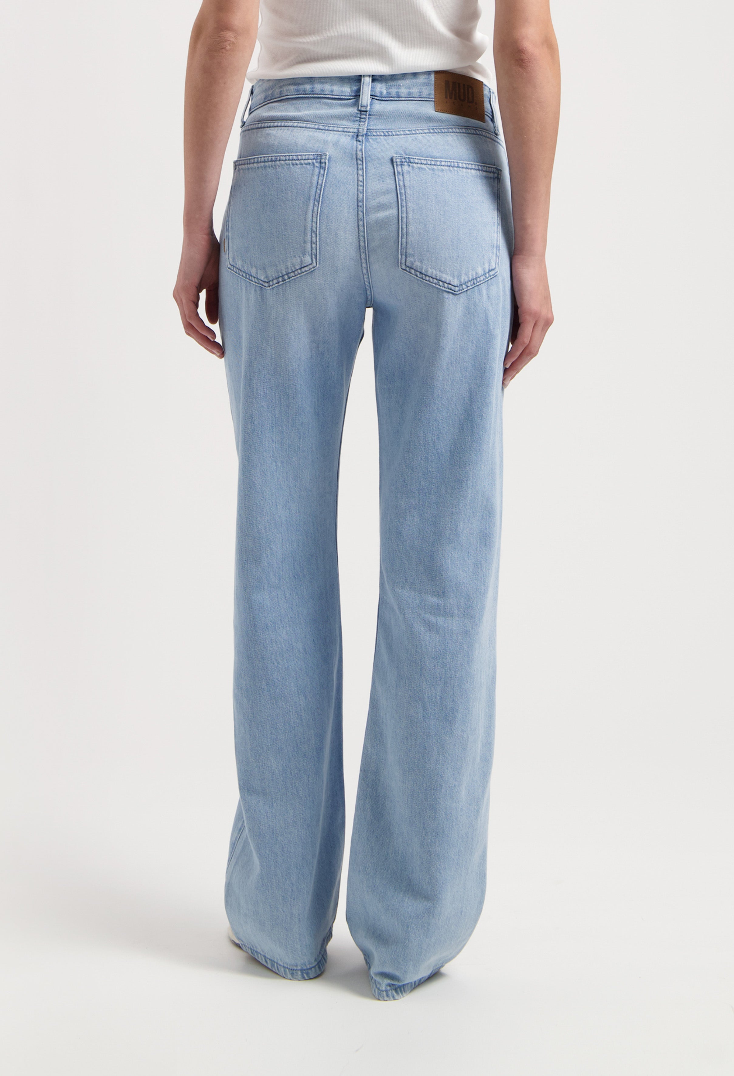 Straight-leg light blue MUD Jeans made from durable denim, showcasing a back view with classic pocket style.