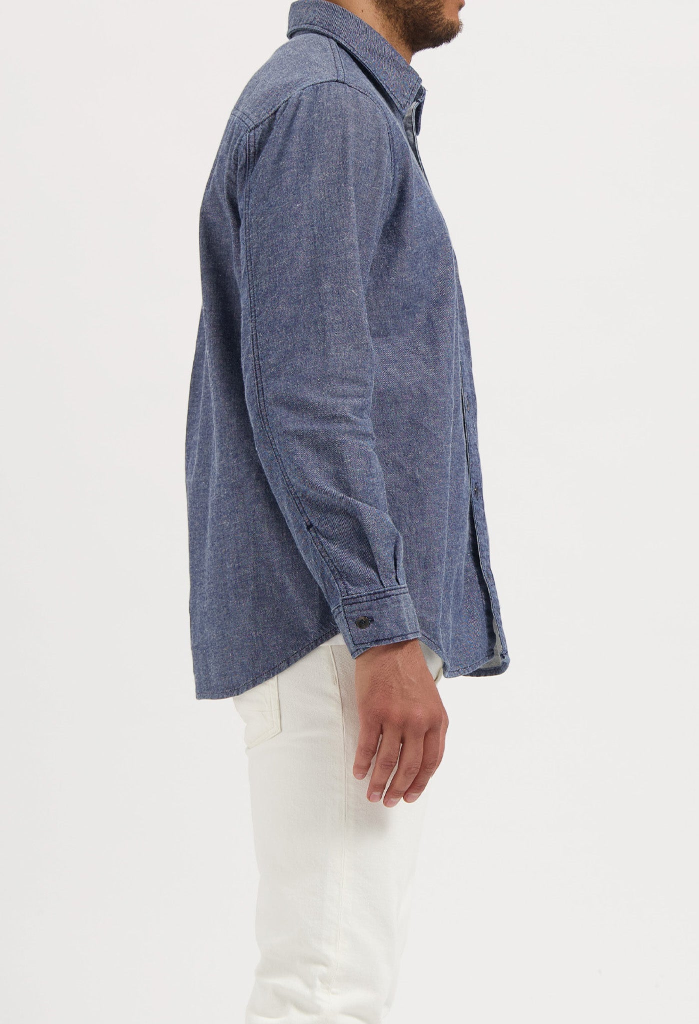 Sustainable MUD Jeans featuring dark blue denim, crafted from ethical materials, shown with a black t-shirt.