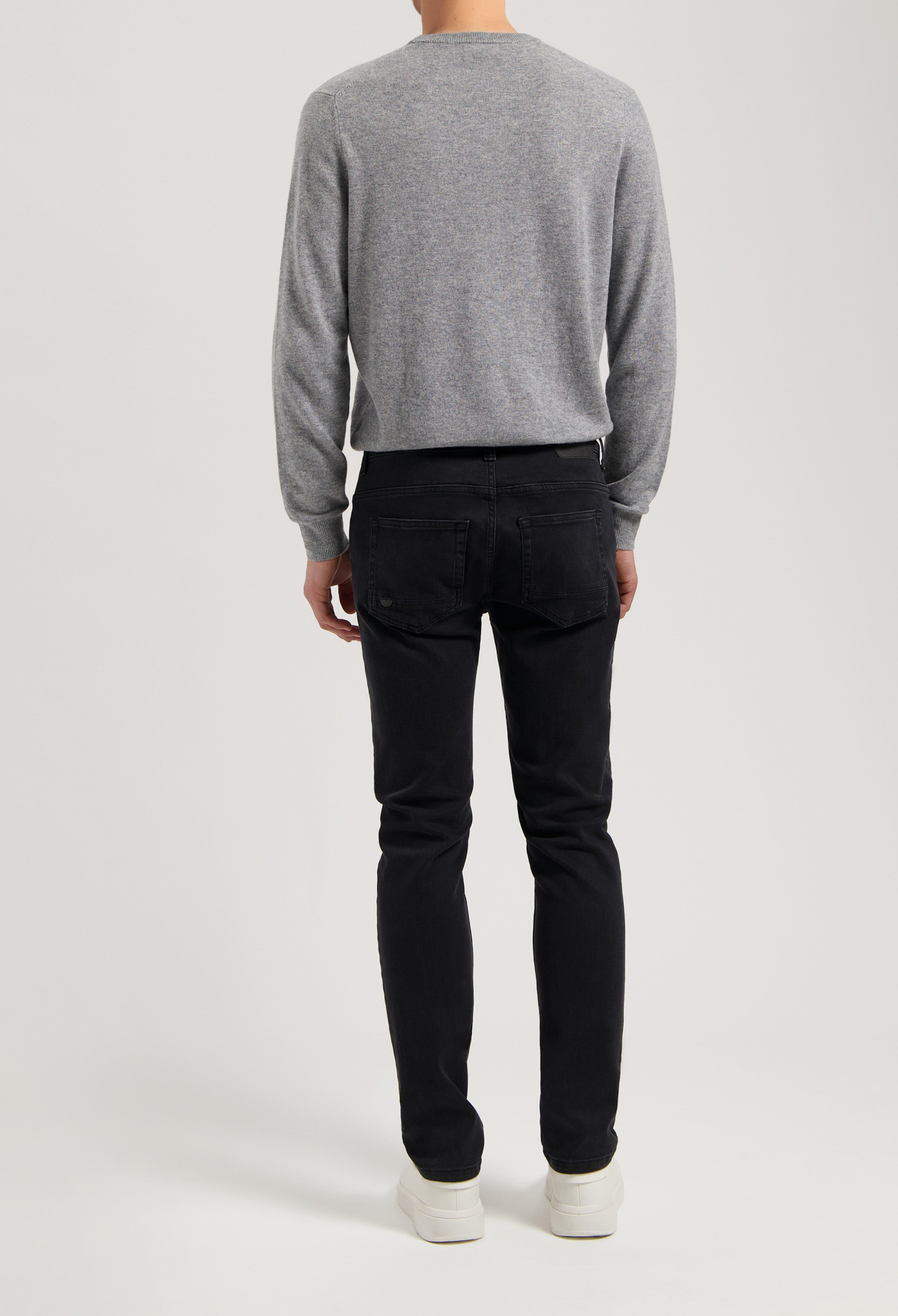 Sustainable MUD Jeans in deep blue denim, crafted from eco-friendly materials, featuring a modern slim fit and ethical design.