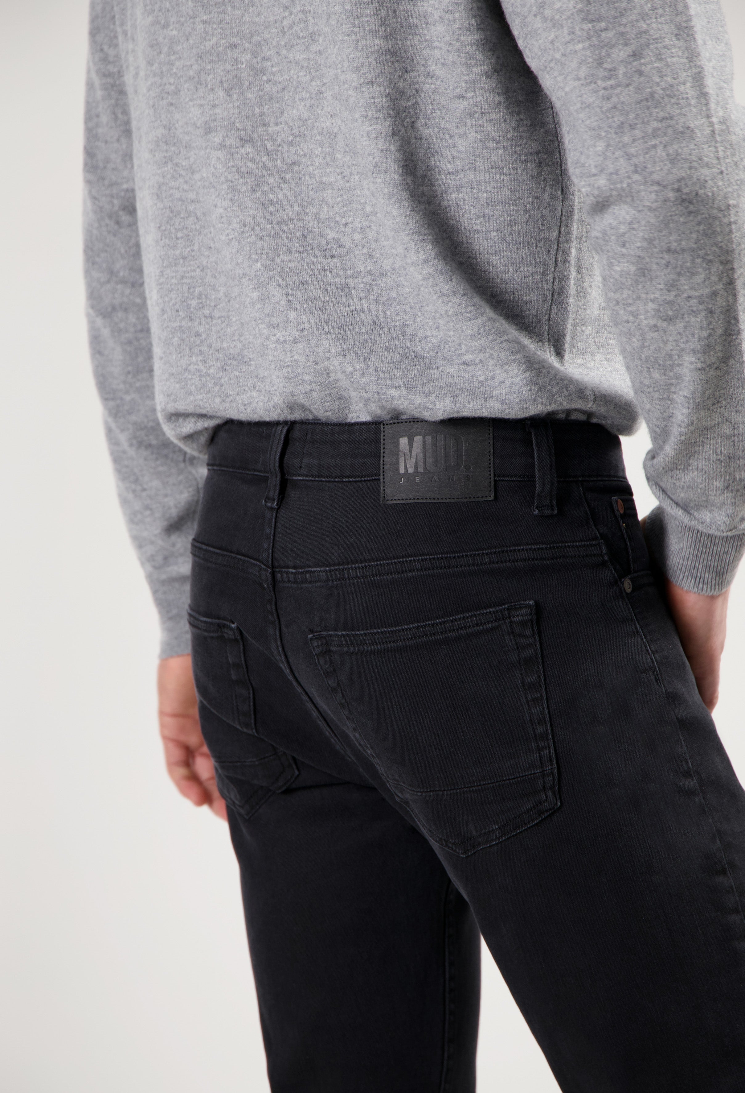 Sustainable MUD Jeans in light blue denim, crafted from eco-friendly materials, showcasing a classic straight-leg fit.