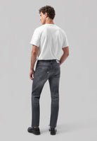 Sustainable MUD Jeans in light blue denim, featuring ethical materials and a straight fit, paired with a white T-shirt.