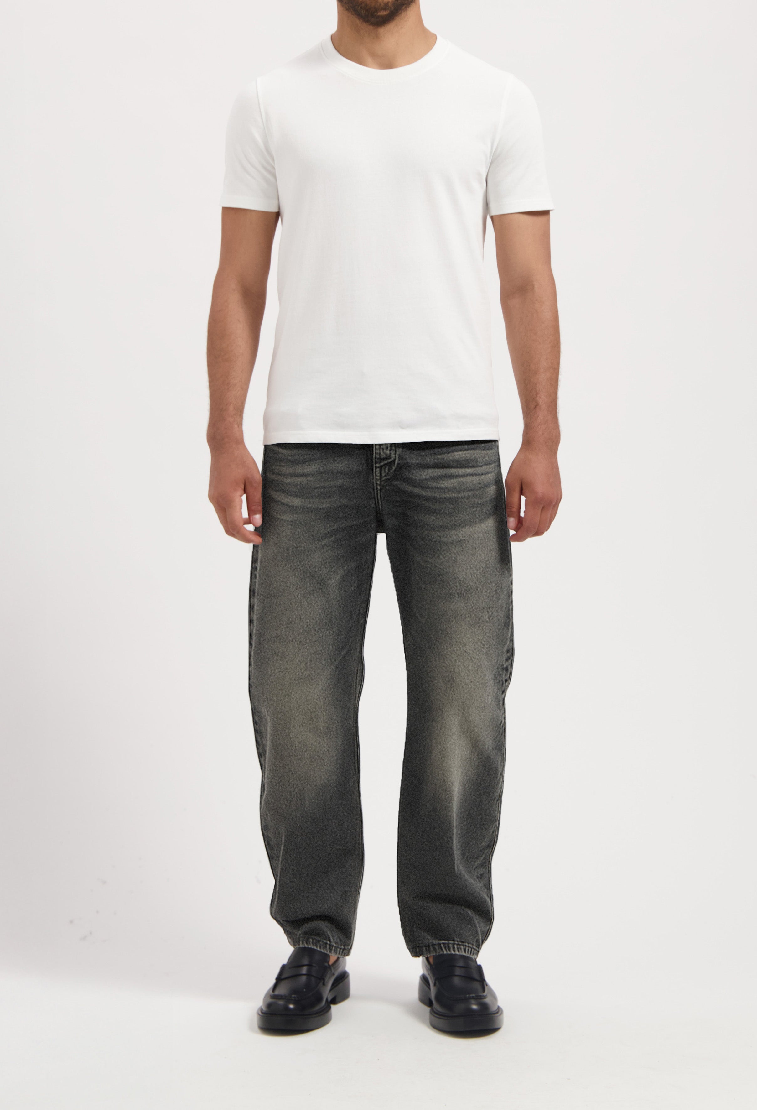 Sustainable MUD Jeans in deep blue denim, featuring ethical craftsmanship with signature pocket stitching detail.