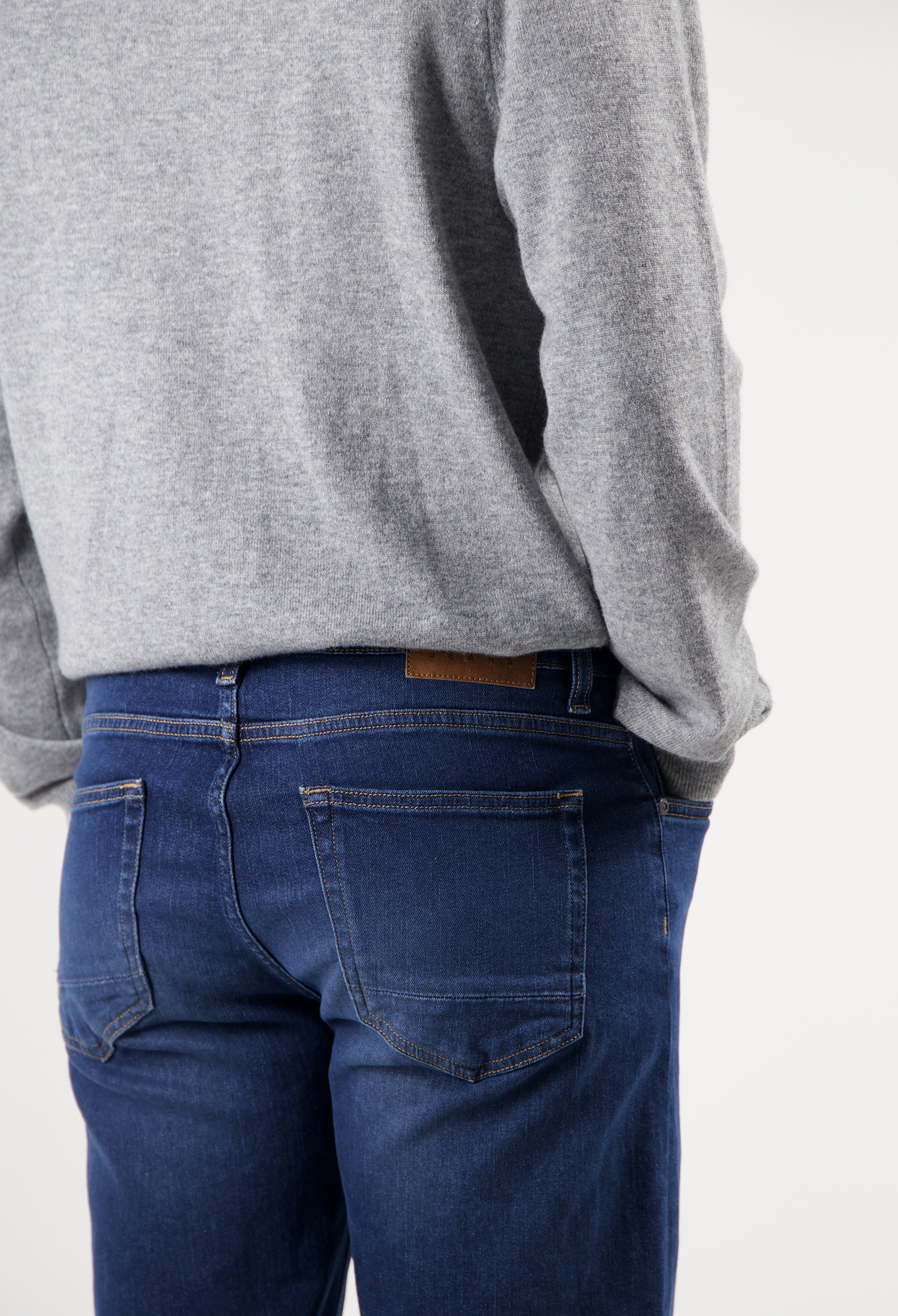 Sustainable MUD Jeans in light blue denim, paired with matching denim jacket, showcasing ethical fashion in classic fit.