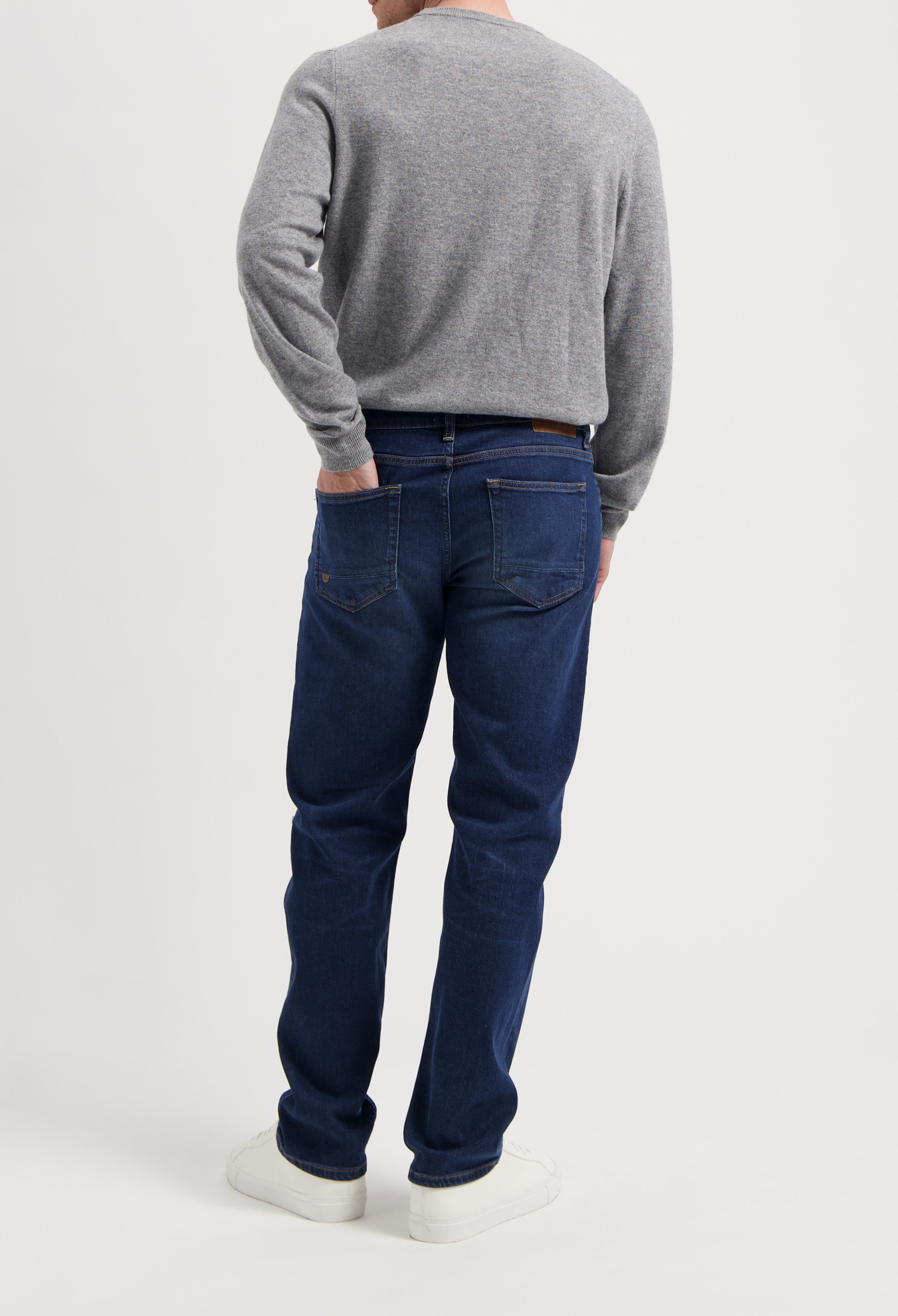 Sustainable MUD Jeans denim jacket in classic blue, crafted ethically with organic materials, paired with matching jeans.