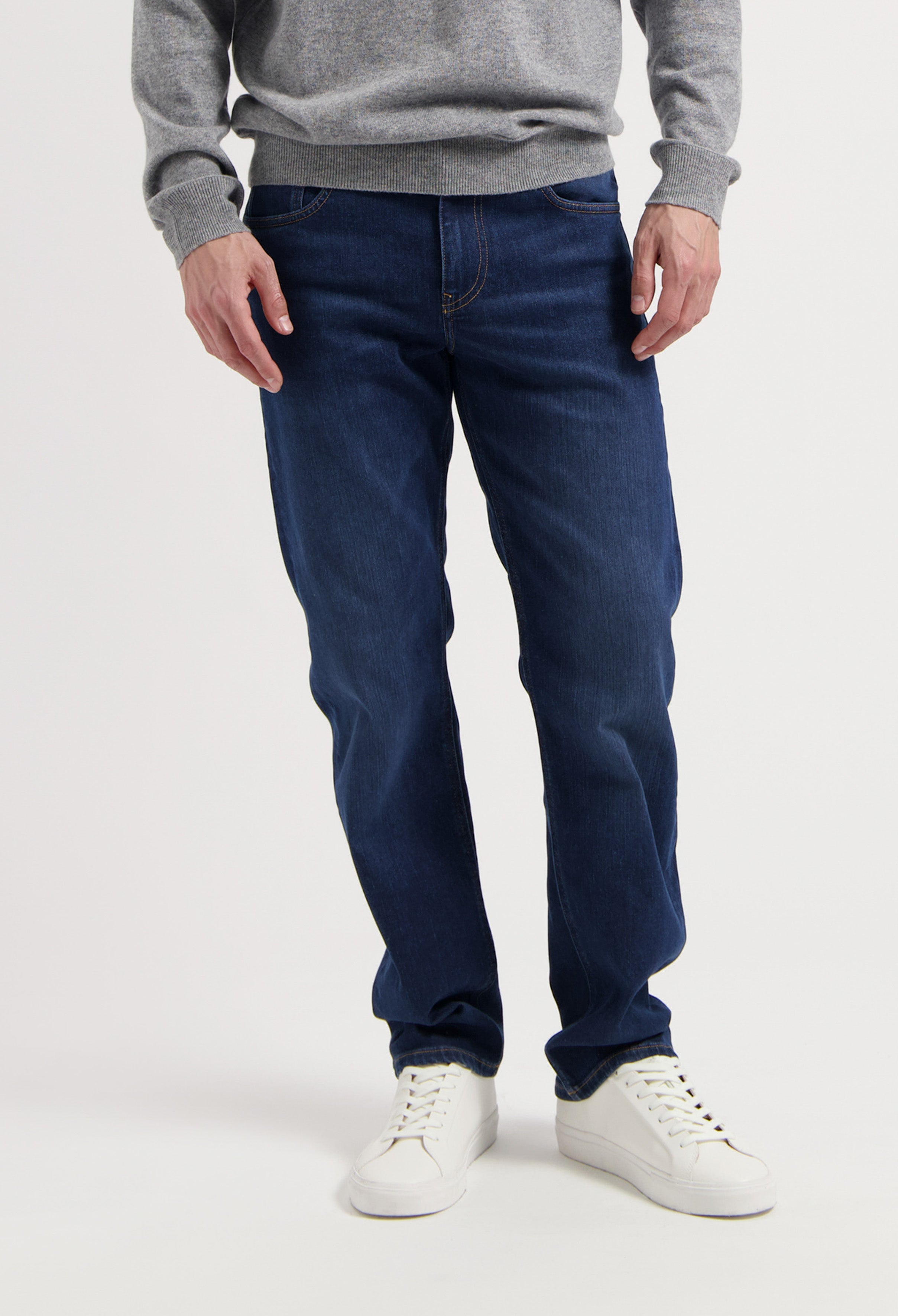 Sustainable MUD Jeans denim jacket in faded blue, featuring ethical organic cotton, worn with matching jeans.