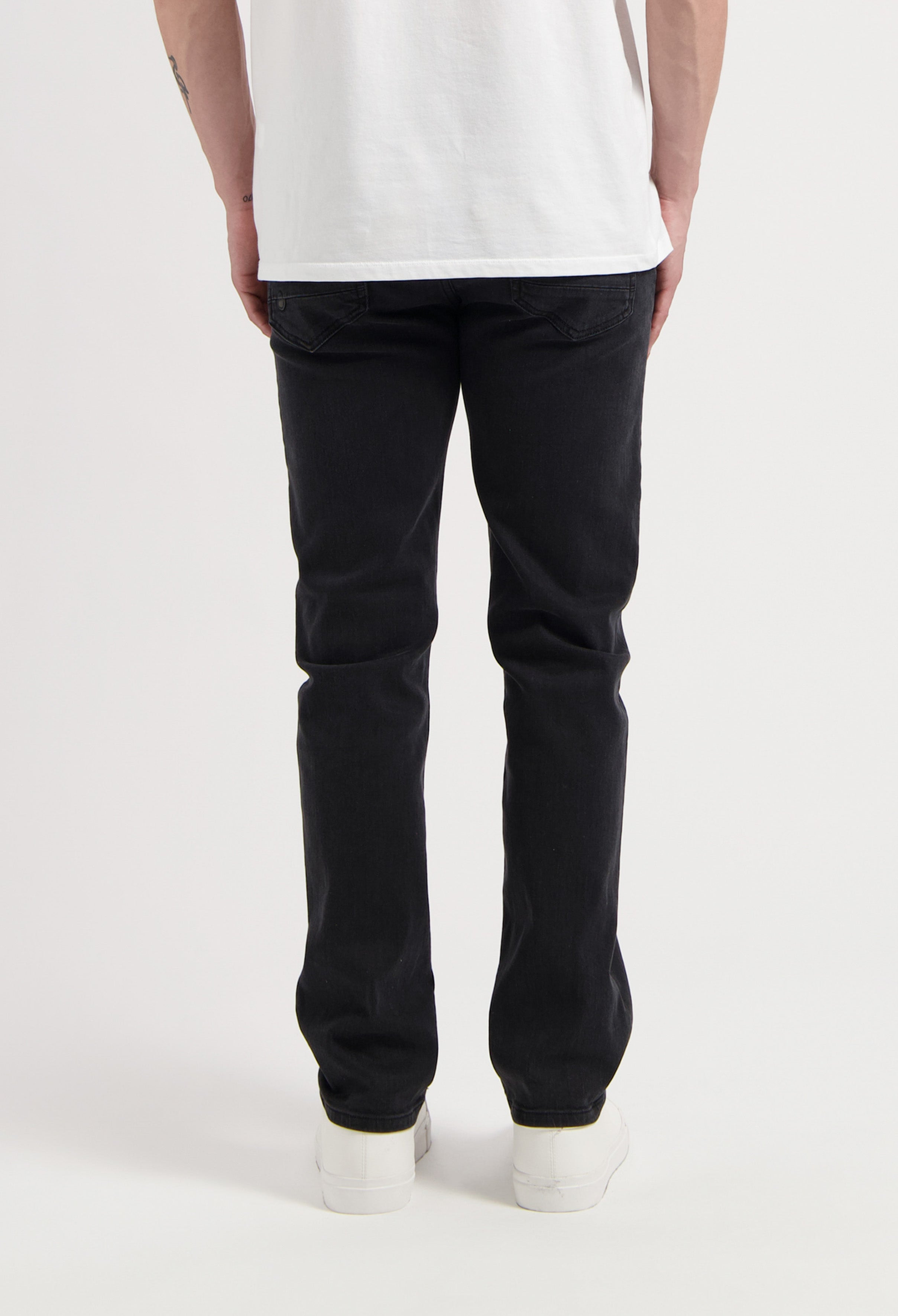 Sustainable MUD Jeans in a classic fit with light blue denim, emphasizing ethical fashion and eco-friendly materials.