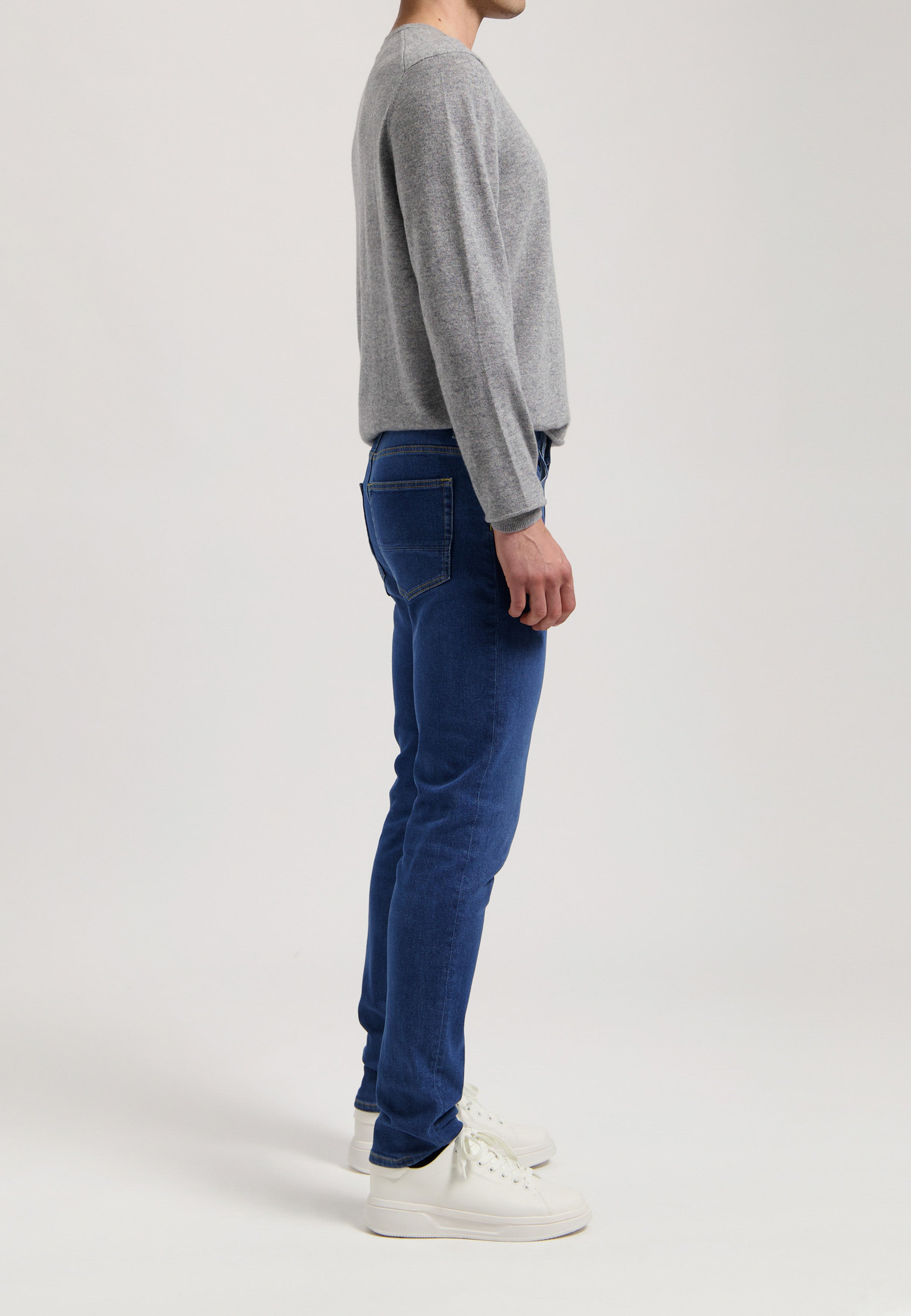 Sustainable MUD Jeans blue denim shorts paired with a white T-shirt, emphasizing eco-friendly fashion and style.