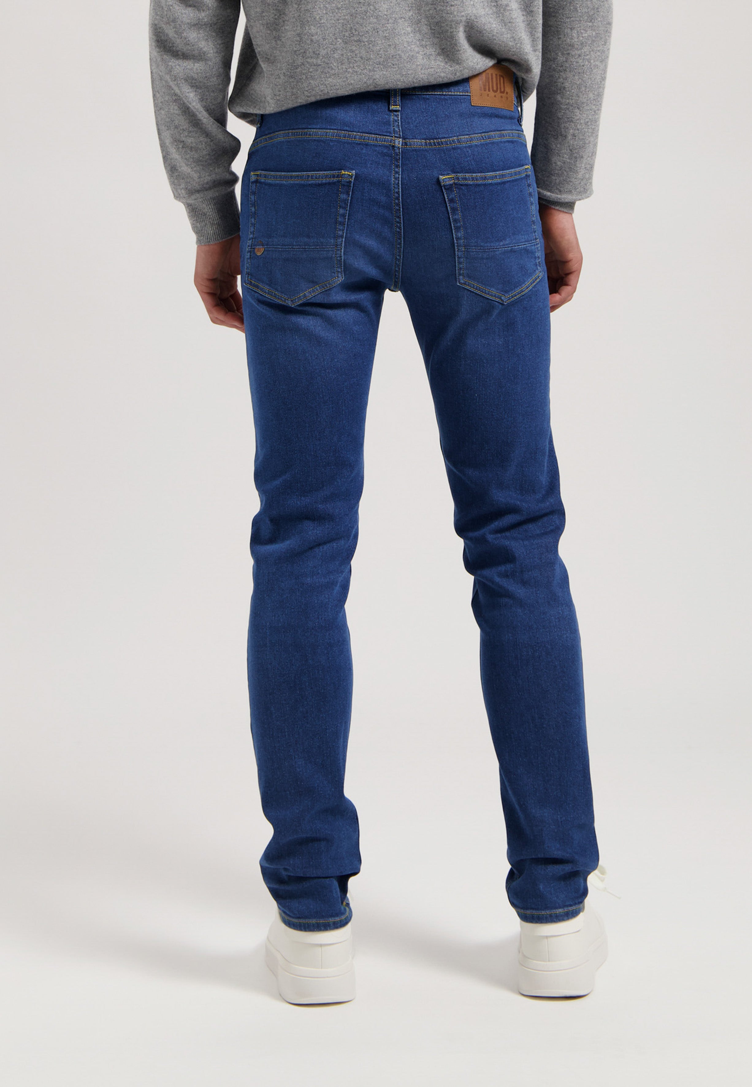Sustainable MUD Jeans denim jacket and jeans in medium blue wash, showcasing ethical fashion in classic fit.