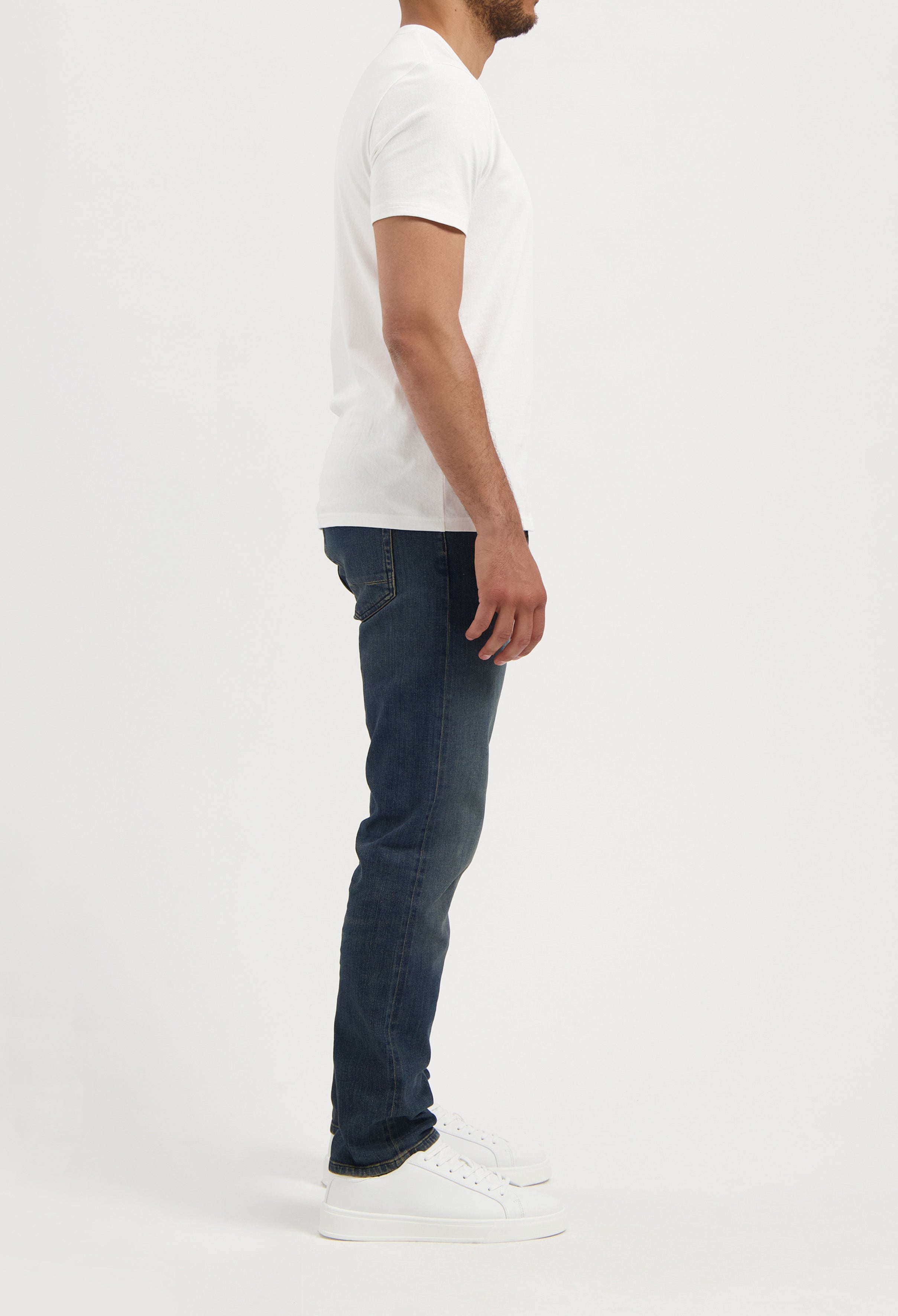 Sustainable MUD Jeans in light blue denim, crafted from organic materials, showcasing classic rear pocket design.