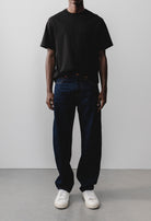 Sustainable MUD Jeans in light blue denim, crafted from organic cotton, showcasing ethical fashion and eco-friendly style.