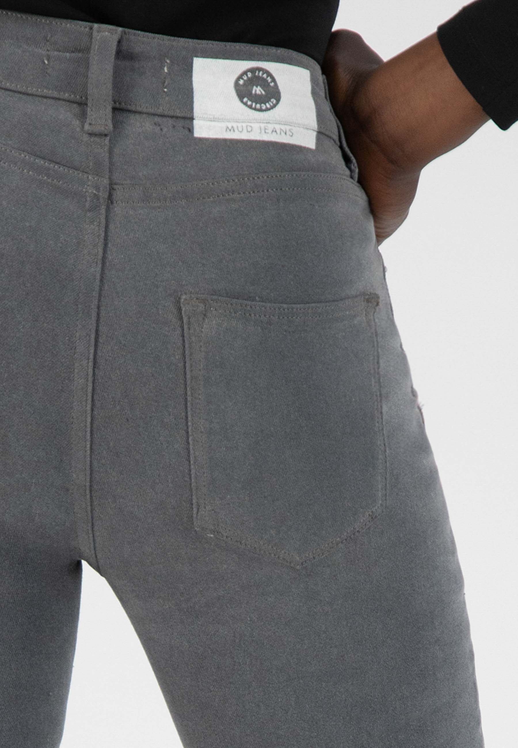 Gray organic cotton jeans by MUD Jeans, showcasing sustainable design with a visible back pocket and waistband label.